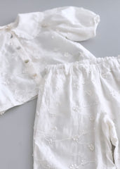 Completo bambina con ricamo all over